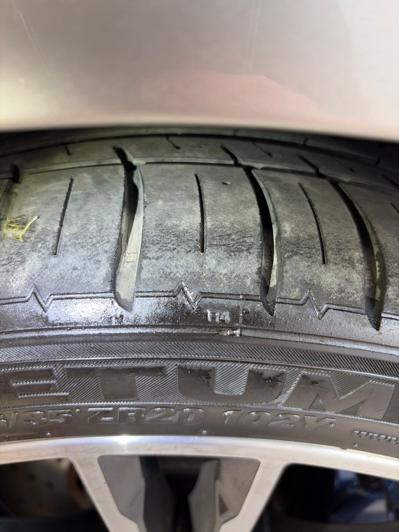 Tyre with cracks running across the sidewall and shoulder